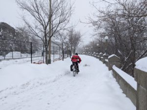 Person biking in the snow in Ottawa