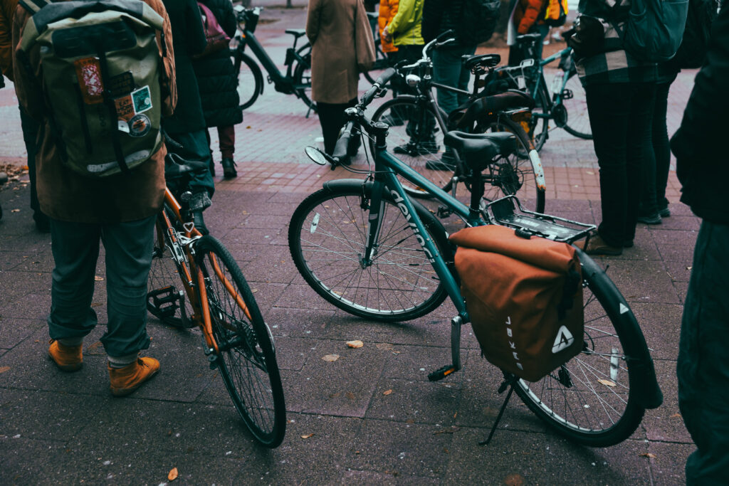 Bikes around people attending the Bill 60 rally, seen at bike level.
