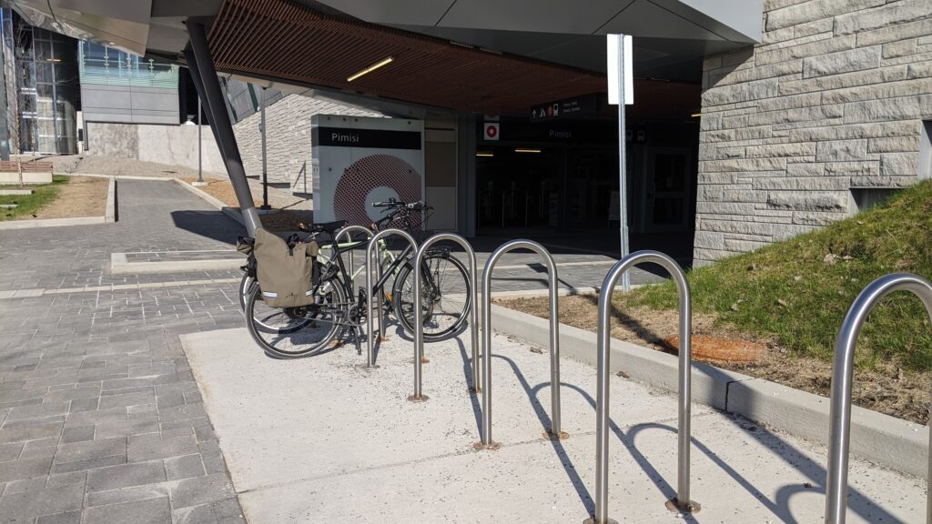 Picture of a bicycle locked to a staple rack outside of Pimisi station in Ottawa